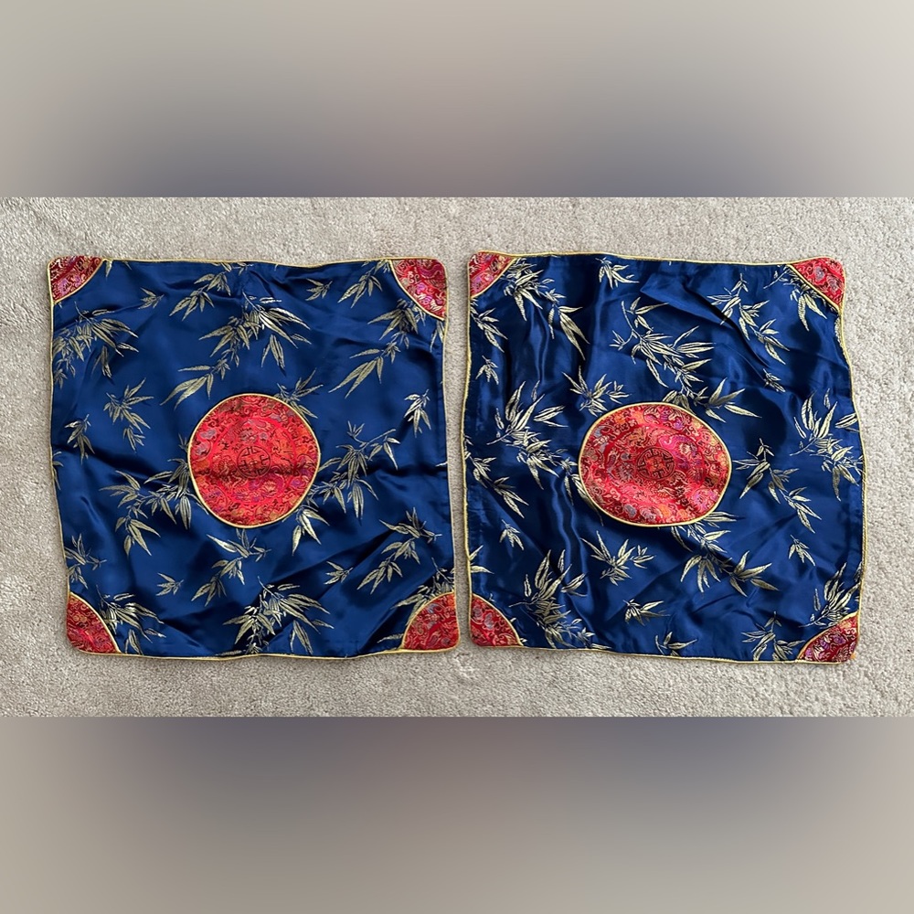 A matching set of satin pillow case covers.